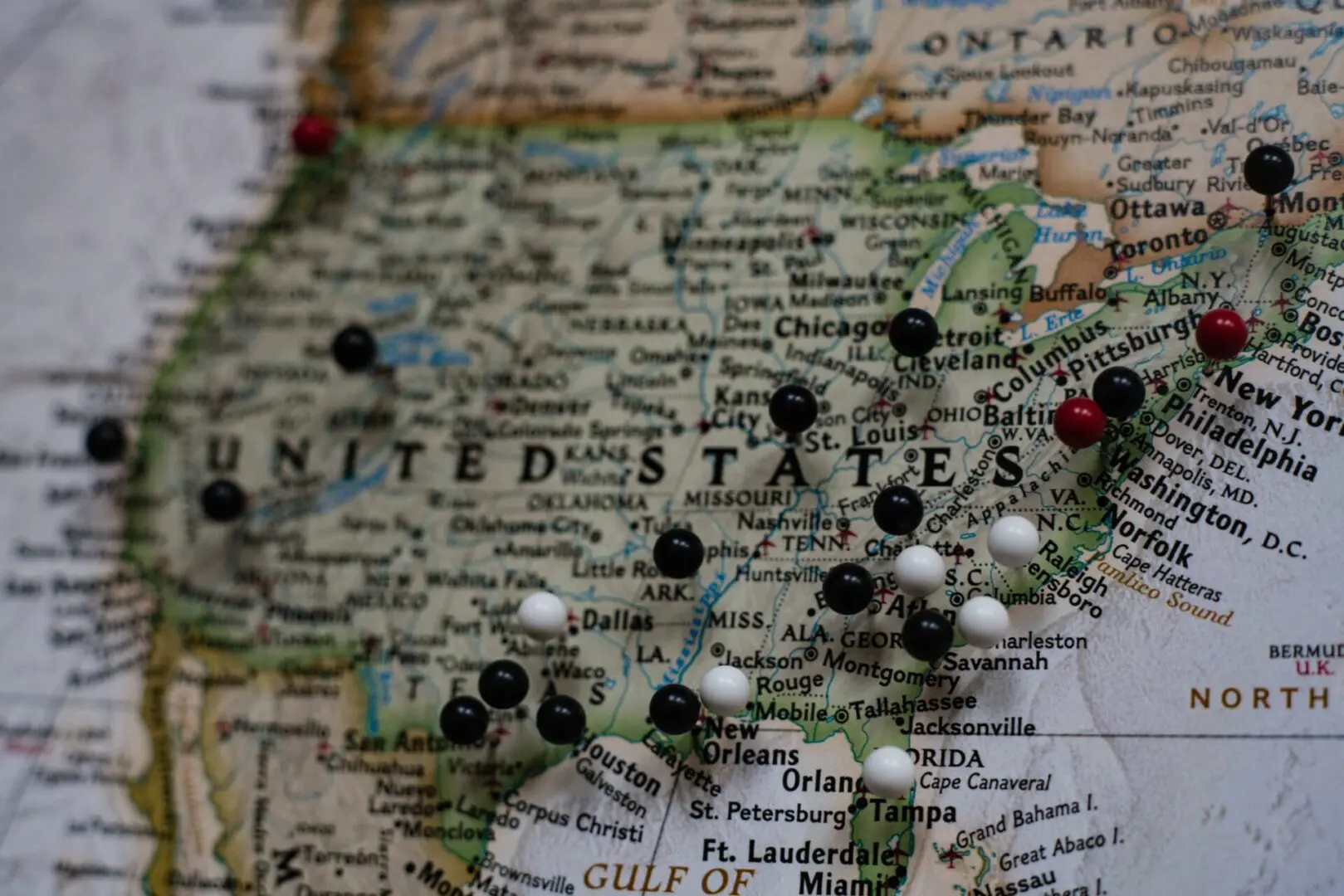 Black and white pins on a map